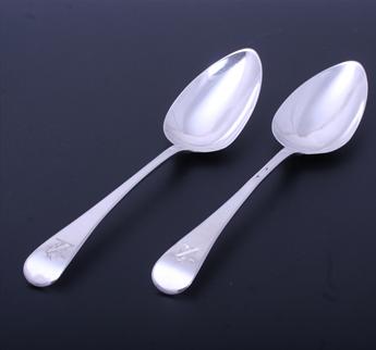 A pair of George III sterling silver Old English pattern table spoons
