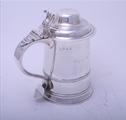 MARITIME INTEREST: A George II silver tankard