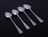 Matched set of four George III sterling silver Old English pattern dessert spoons