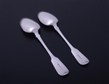 A pair of Regency sterling silver fiddle pattern table spoons