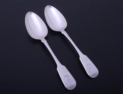 A pair of Regency sterling silver fiddle pattern table spoons