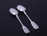 A pair of William IV fiddle pattern sterling silver dessert spoons