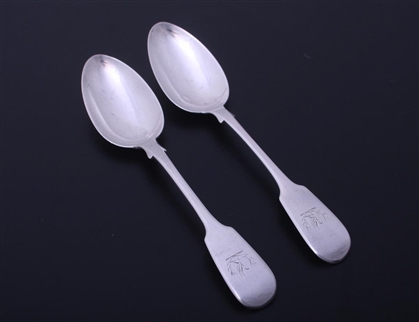 A pair of William IV fiddle pattern sterling silver dessert spoons