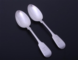 A pair of William IV fiddle pattern sterling silver dessert spoons