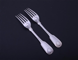 A pair of Victorian fiddle, thread and shell sterling silver table forks