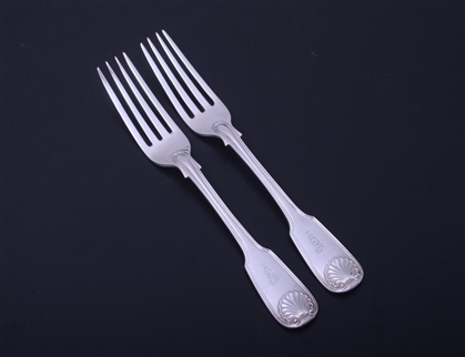 A pair of Victorian fiddle, thread and shell sterling silver table forks