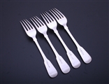 A set of four George IV Scottish fiddle pattern sterling silver pattern table forks