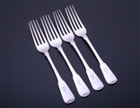 A set of four George IV Scottish fiddle pattern sterling silver pattern table forks