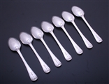 A set of seven Edwardian sterling silver Old English thread pattern dessert spoons