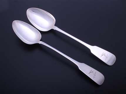 A pair of Irish George IV sterling silver fiddle pattern basting or gravy spoons