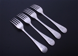 WORTH FAMILY: A matched set of four Old English with thread pattern silver table forks