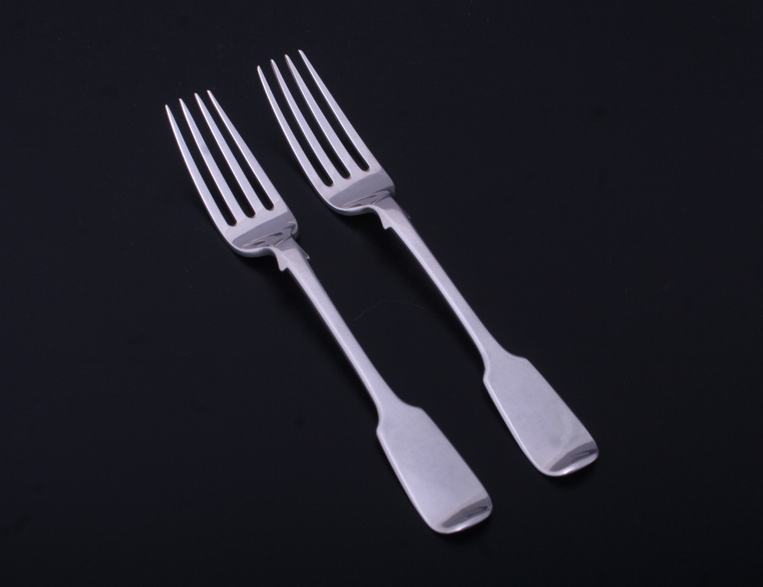 A pair of Irish Victorian sterling silver fiddle pattern dessert forks