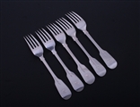 A set of five Victorian sterling silver fiddle pattern table forks