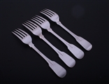 A set of four George III sterling silver fiddle pattern table forks
