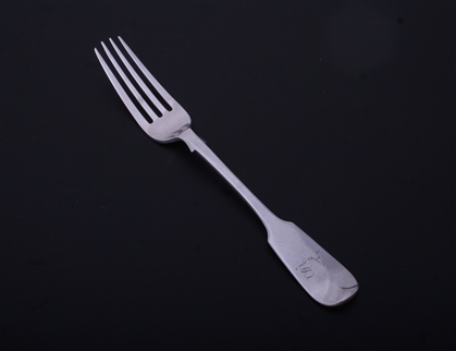A Victorian sterling silver fiddle pattern table fork