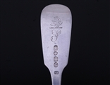 A Victorian sterling silver fiddle pattern table fork