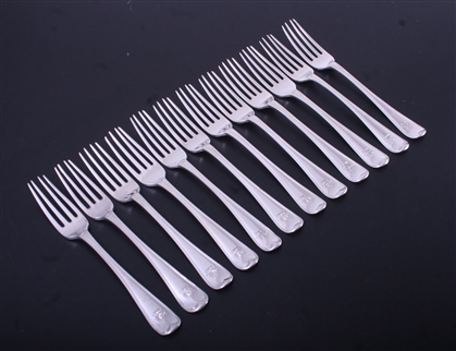 A matched set of twelve George III sterling silver Old English thread table forks