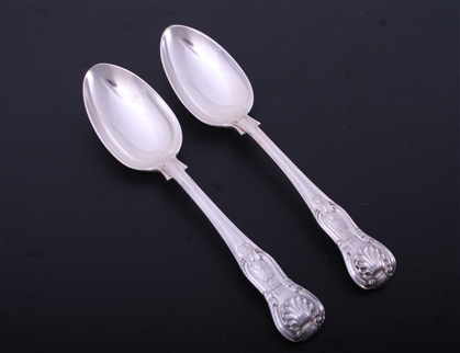 A pair of Victorian Hourglass pattern sterling silver dessert spoons