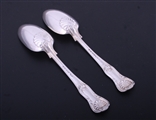A pair of Victorian Hourglass pattern sterling silver dessert spoons