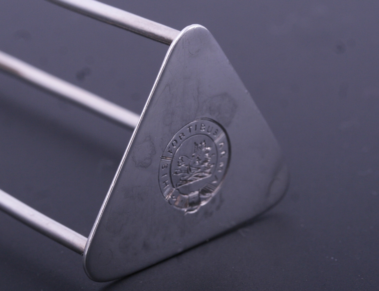 A matched set of four III sterling silver wire work knife rests