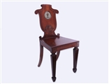 A good pair of George IV mahogany armorial hall chairs attributed to T & G Seddon