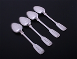 A set of four Victorian fiddle and thread pattern sterling silver table spoons