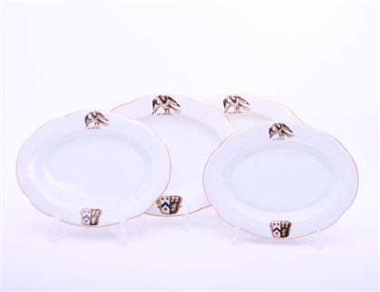 WILLES: A set of four George III oval shaped armorial porcelain dishes