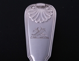 A set of eight George III fiddle, thread and shell pattern sterling silver table spoons