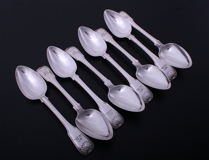 A set of eight George III fiddle, thread and shell pattern sterling silver table spoons