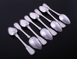 A set of eight George III fiddle, thread and shell pattern sterling silver table spoons