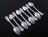 A set of eight George III fiddle, thread and shell sterling silver dessert spoons