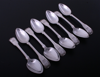 A set of eight George III fiddle, thread and shell sterling silver dessert spoons
