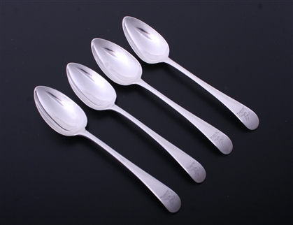 A matched set of four George III Old English pattern sterling silver dessert spoons