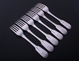 A set of six George III fiddle pattern sterling silver table forks