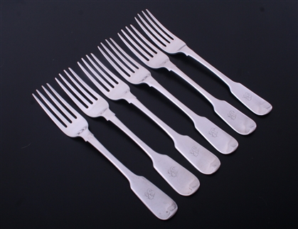 A set of six George III fiddle pattern sterling silver table forks