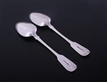 A pair of George IV fiddle pattern sterling silver table spoons