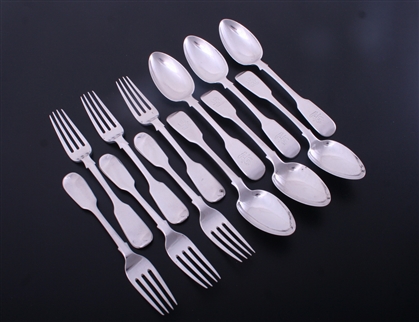 A set of Victorian fiddle pattern sterling silver dessert forks and spoons
