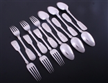 A set of Victorian fiddle pattern sterling silver dessert forks and spoons