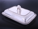 A fine pair of George III sterling silver entree dishes with armorial finials
