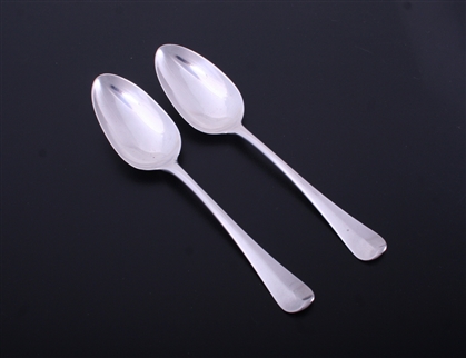 A pair of George III Hanoverian pattern sterling silver table spoons