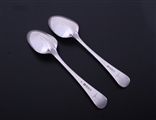 A pair of George III Hanoverian pattern sterling silver table spoons