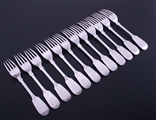 A set of twelve Victorian sterling silver fiddle pattern dessert forks
