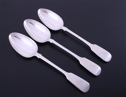 A matched set of three Victorian fiddle pattern sterling silver table spoons