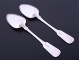A pair of George III fiddle pattern sterling silver table spoons