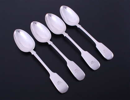 A matched set of four Victorian fiddle pattern sterling silver table spoons