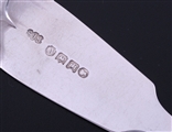 A matched set of four Victorian fiddle pattern sterling silver table spoons