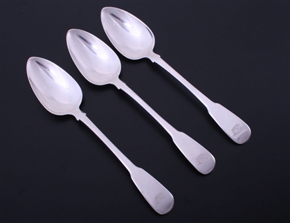 A set of three George III fiddle pattern sterling silver table spoons