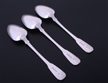 A set of three George III fiddle pattern sterling silver table spoons