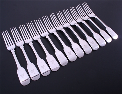 A matched set of William IV and later fiddle pattern sterling silver table forks