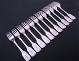 A matched set of William IV and later fiddle pattern sterling silver table forks